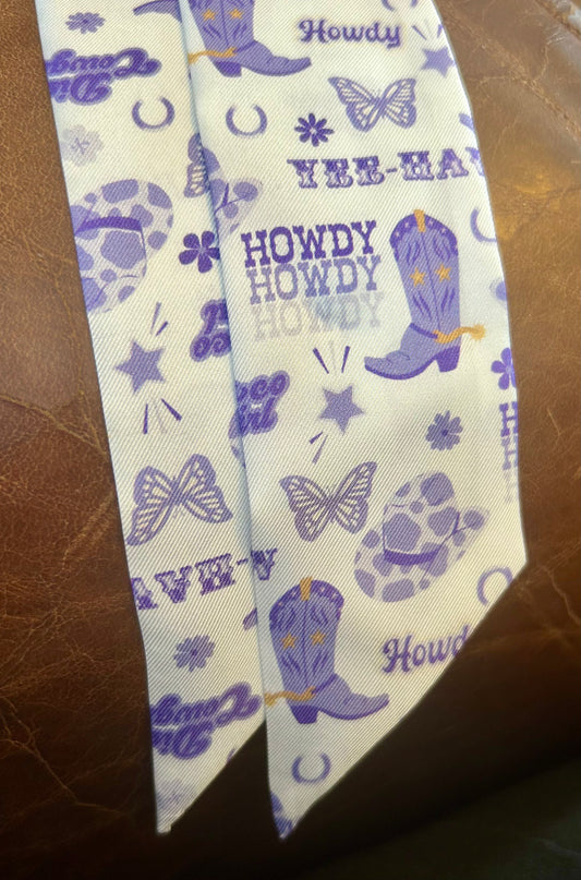 • Purple western twilly scarf tied on brown leather purse
• Tarleton inspired howdy scarf accessory
• Purple cowboy boot hair ribbon for college girls
• Western purse scarf for Stephenville Texas