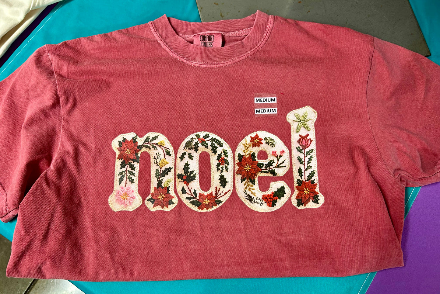 NOEL Floral Comfort Colors Christmas Tee – Embroidered-Style Holiday Graphic Shirt