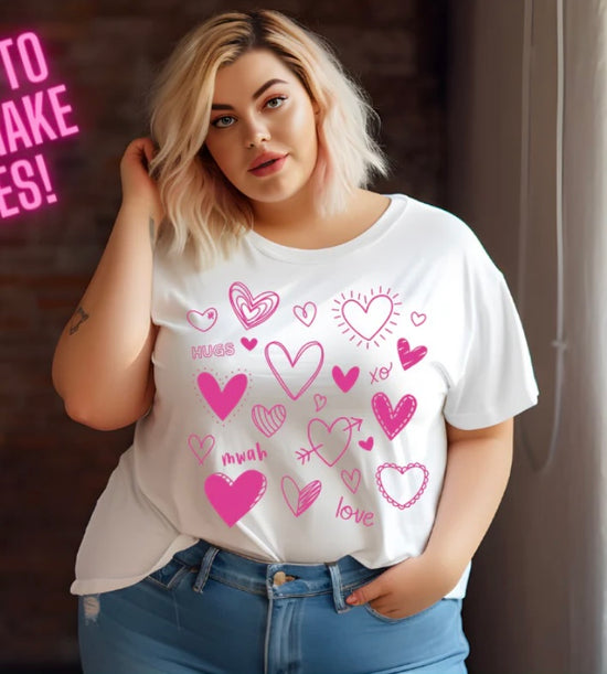 White t-shirt with pink heart doodle graphics and love icons, casual women’s graphic tee