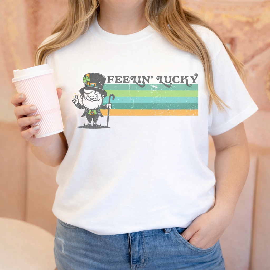 Feelin’ Lucky St. Patrick’s Day Shirt – Vintage Leprechaun Graphic Tee – Cute Lucky Charm Shirt – Women’s White Short Sleeve